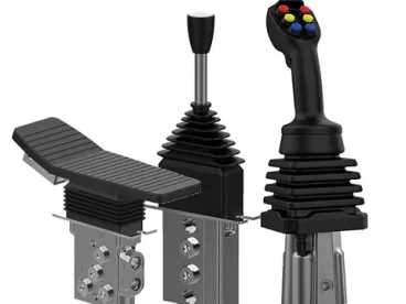 A picture in includes hydraulic pilot control device for a joystick, a stackable and a foot-pedal